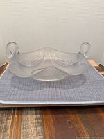 Front view showing swan-head handles and frosted feather pattern