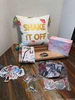 Lot overview showing pillow, sealed gift pack contents
