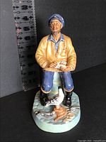Front view of Royal Doulton The Seafarer figurine with ruler indicating 9 in height