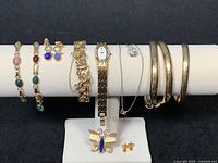 All jewellery pieces displayed on bracelet bar and stand