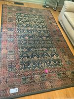 Full view of rug showing complete pattern and colours