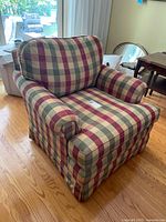 Front and side view of plaid armchair