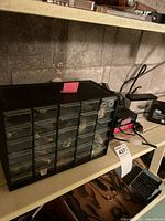 30-drawer organizer, charger and batteries on shelf