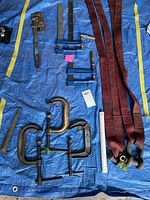 Overview with clamps, pipe wrench, straps, shackles