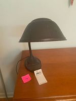 Full view of lamp on desk showing shade and base