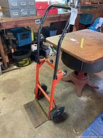 Full view of convertible hand truck dolly standing upright
