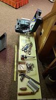 Overall lot showing sharpener case, hand tools laid out