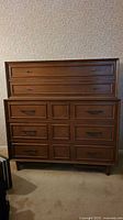 Front view of Gibbard highboy dresser showing five drawers and hardware