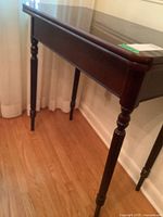 Table angled view closed showing top and legs