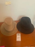 Both hats side by side on tabletop