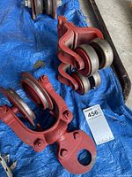 Both cast iron pulley blocks on tarp