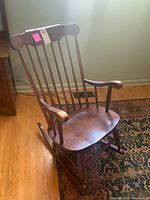front angled view of wooden rocking chair