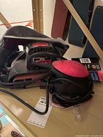 Craftsman belt sander, Mouse palm sander, sandpaper on shelf