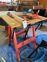 Full view of red Hirsh saw table with guides attached on top
