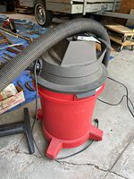 Full view of red 10-gallon Shop-Vac with hose and floor nozzle