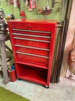 Front view of Waterloo red tool chest showing drawers and casters