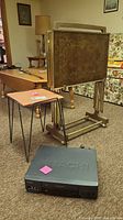 Overall lot showing tray tables on stand, vinyl stool, Hitachi VCR