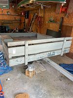 full view of wooden trailer in garage