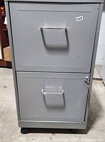 Front view showing both drawers, handles, wheels