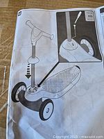 Assembly instruction sheet showing scooter design