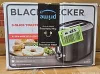 Front view of boxed Black & Decker toaster showing product image and branding