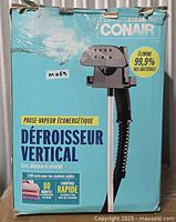 Front of Conair upright fabric steamer retail box