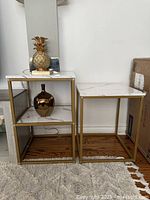 Front view of both end tables showing size difference and finishes