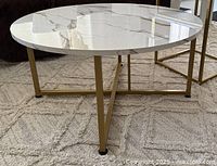 Top view showing marble-look surface and round shape