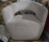 Front view of upholstered rolling arm chair