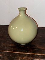 Full view front of pale celadon globular vase