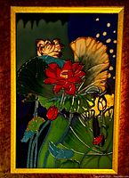 Close view of lotus enamel artwork showing colors and cloisonné effect