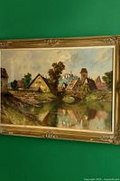 Frontal view of entire framed painting against green wall