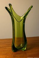 Frontal view of three-finger chartreuse art glass vase