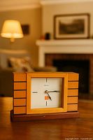Clock on table in staged room showing overall appearance and scale