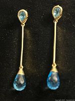 Full view of both dangling earrings showing design and length