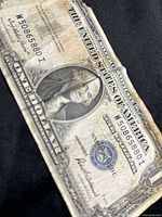 Full note showing portrait, seal and missing corner