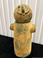 Full view of assembled terra-cotta figure sculpture