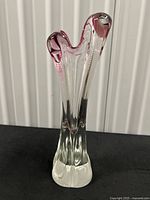 Full view of vase showing clear body and cranberry rim