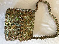Front view of woven recycled-material purse