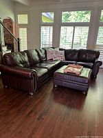 Full sectional sofa with ottoman, tray and pillows in room setting