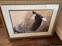 Front view of framed bald eagle print showing artwork, frame, mat