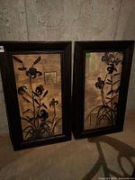Both framed floral prints side by side