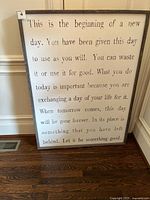 Front view of entire sign showing quote and frame