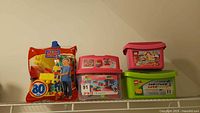 Mega Bloks 80-piece bag and three plastic tubs on shelf