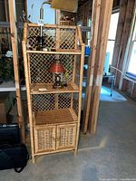 Front view showing overall etagere with shelves and cabinet