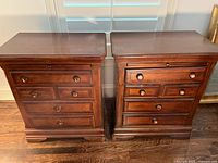 Front view of both nightstands showing drawer arrangement and finish