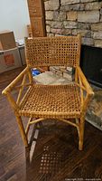 Front view of wicker armchair showing overall design