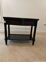 Full view of table front showing two drawers, closed top