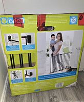 Back view of the baby gate box showing product features logo and installation images