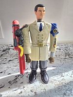 Front view of the large Inspector Gadget collectible figure showing detailed features and mechanical arms.